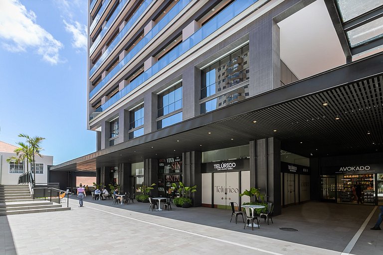 HOMS Studios | Prédio com foodmarket integrado